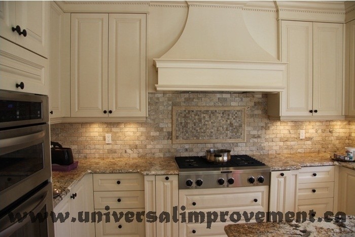 Inspiration for a large traditional kitchen in Toronto with beige cabinets, travertine floors and beige floor.