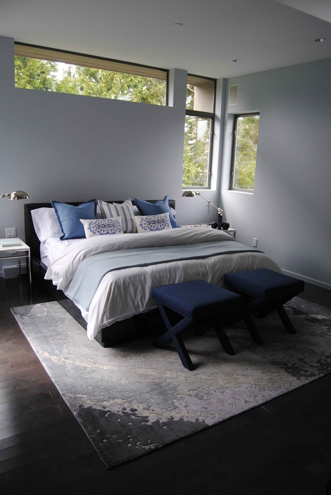 Photo of a contemporary bedroom in Vancouver with grey walls and dark hardwood floors.
