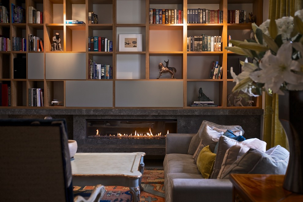 Design ideas for a large contemporary loft-style living room in Other with a library, grey walls, marble floors, a ribbon fireplace, a stone fireplace surround and no tv.