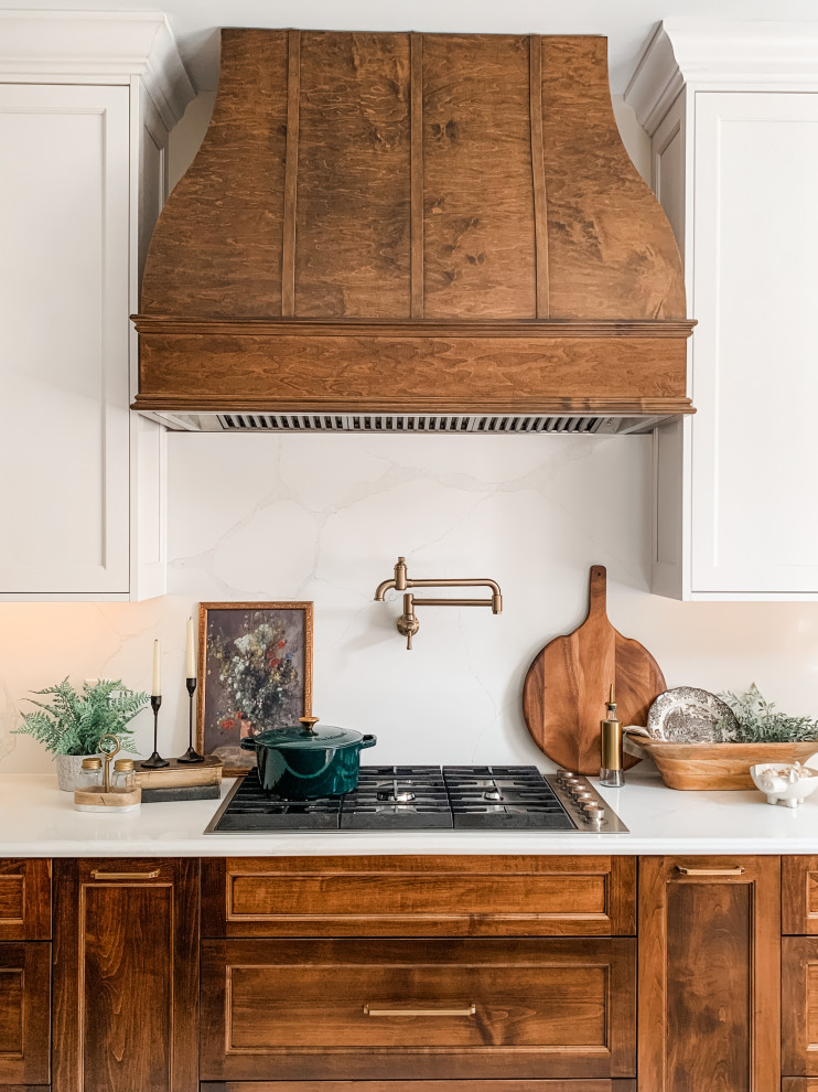 Inspiration for a light wood floor kitchen remodel with a double-bowl sink, shaker cabinets, white cabinets, quartz countertops, quartz backsplash, paneled appliances and an island