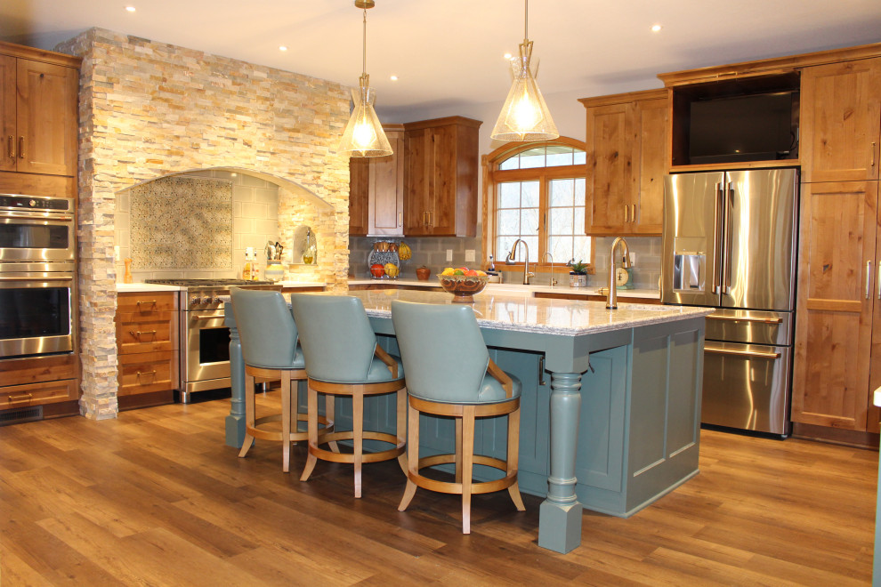 Design ideas for a large traditional l-shaped kitchen/diner in Other with engineered stone countertops and an island.