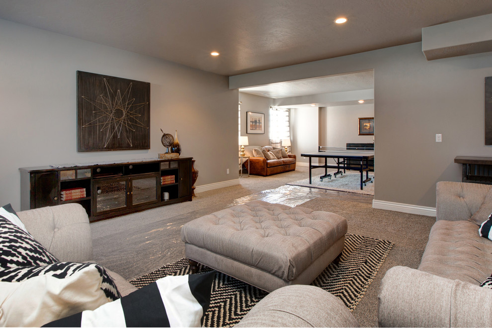 This is an example of a large arts and crafts open concept family room in Salt Lake City with a game room, grey walls, carpet and no fireplace.