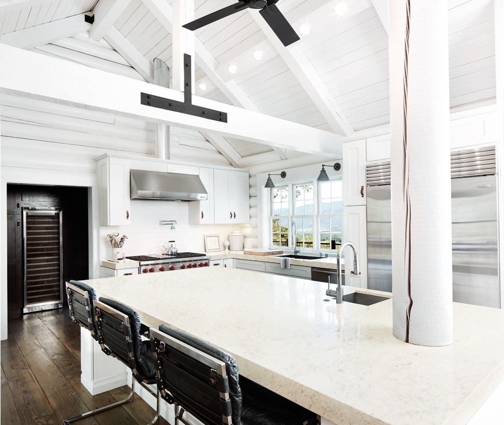 This is an example of a transitional eat-in kitchen in Philadelphia with quartz benchtops.