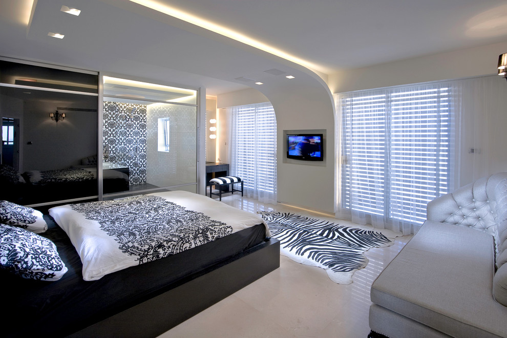 Photo of a contemporary bedroom in Other with beige walls.