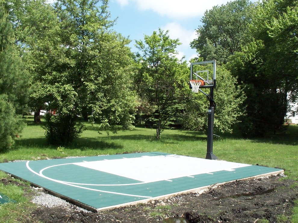 Design ideas for a small traditional backyard partial sun outdoor sport court in Boston with concrete pavers.