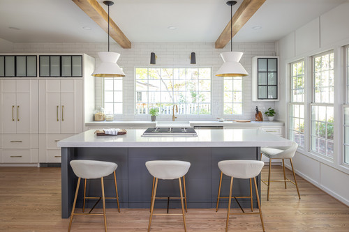 Bright farmhouse-style kitchen with classic white cabinets and wood accents, ranking high among the best kitchen cabinet colors Canada for resale value.