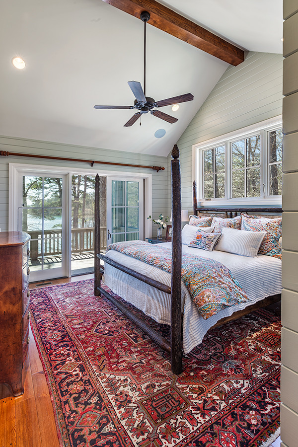 Inspiration for a traditional master bedroom in Other with green walls, medium hardwood floors and no fireplace.