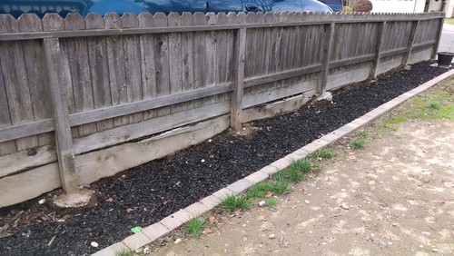 Help Transitioning Between Retaining Wall And Fence On Property Line Plan To Install Rod Iron Fence Gate Separate Front Yard From Side Would Like Elish A Entertaining Area In With Succulent Garden