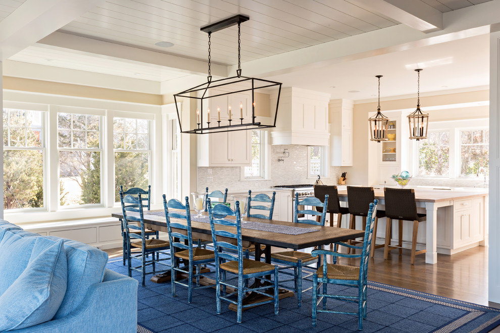 Inspiration for a beach style open plan dining in Boston with medium hardwood floors.
