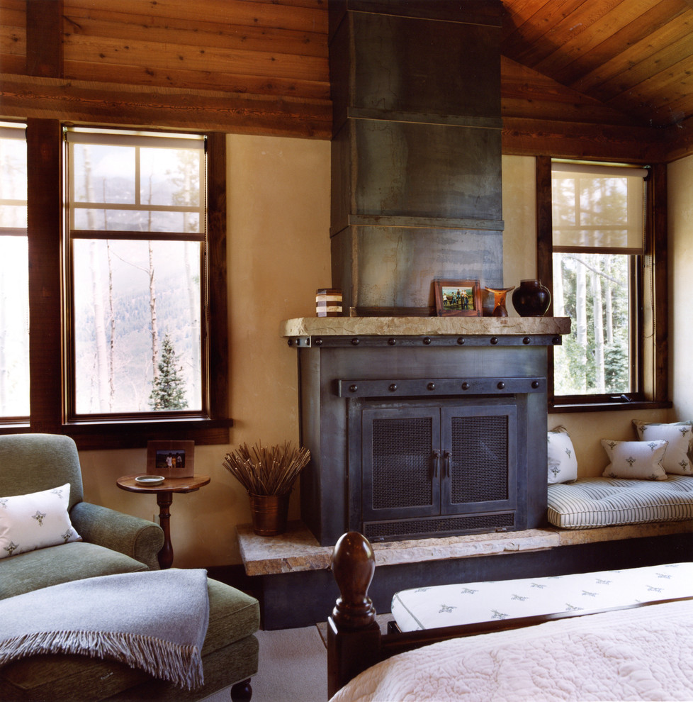 Design ideas for a country bedroom in Other with a standard fireplace.
