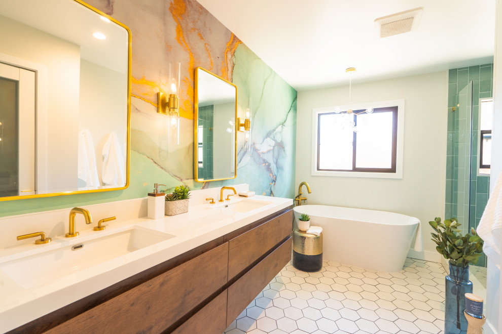 Photo of a mid-sized contemporary master bathroom in San Francisco with flat-panel cabinets, brown cabinets, a freestanding tub, a corner shower, blue tile, ceramic tile, white walls, cement tiles, an integrated sink, engineered quartz benchtops, white floor, a hinged shower door, white benchtops, a double vanity, a floating vanity and wallpaper.