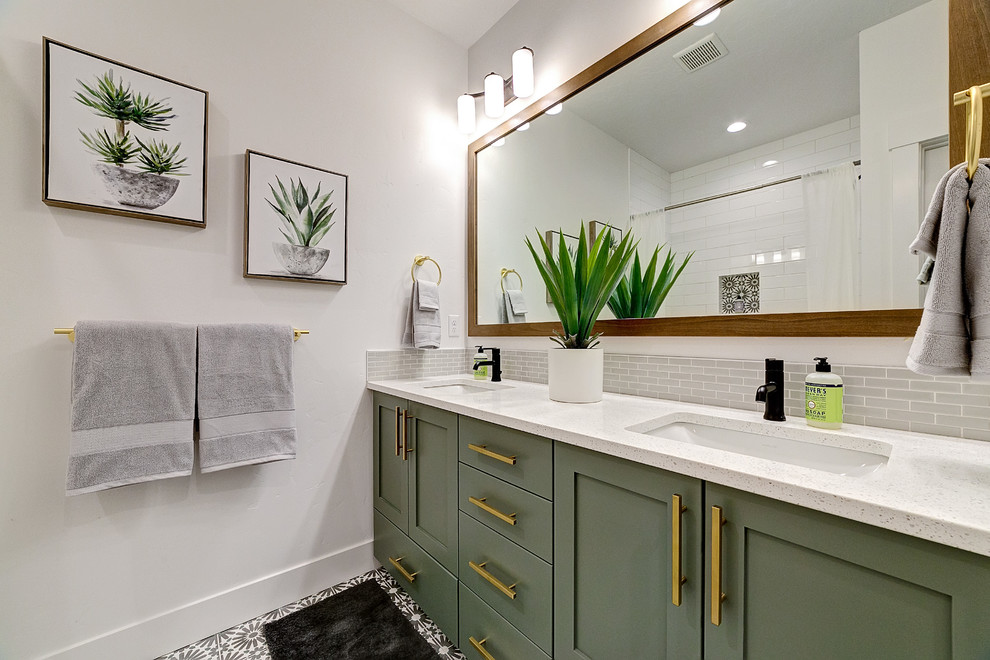 Photo of a mid-sized country bathroom in Boise with shaker cabinets, white walls, an undermount sink, multi-coloured floor, grey cabinets, an alcove tub, a shower/bathtub combo, subway tile, a shower curtain and white benchtops.