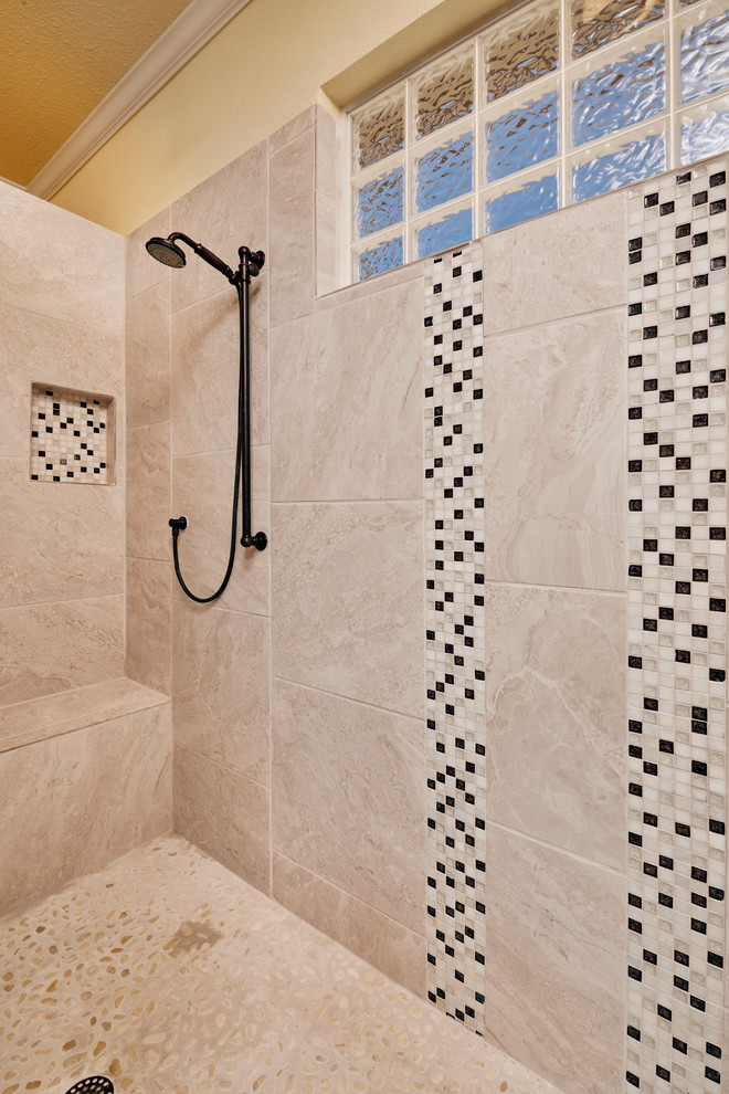 Inspiration for a large transitional master beige tile and ceramic tile ceramic tile and beige floor doorless shower remodel in Austin with raised-panel cabinets, dark wood cabinets, a two-piece toilet, yellow walls, a trough sink, marble countertops and white countertops