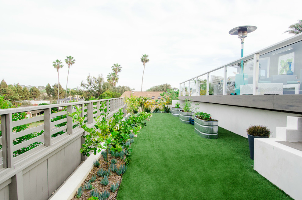 This is an example of a contemporary backyard full sun xeriscape in San Diego with a vegetable garden.