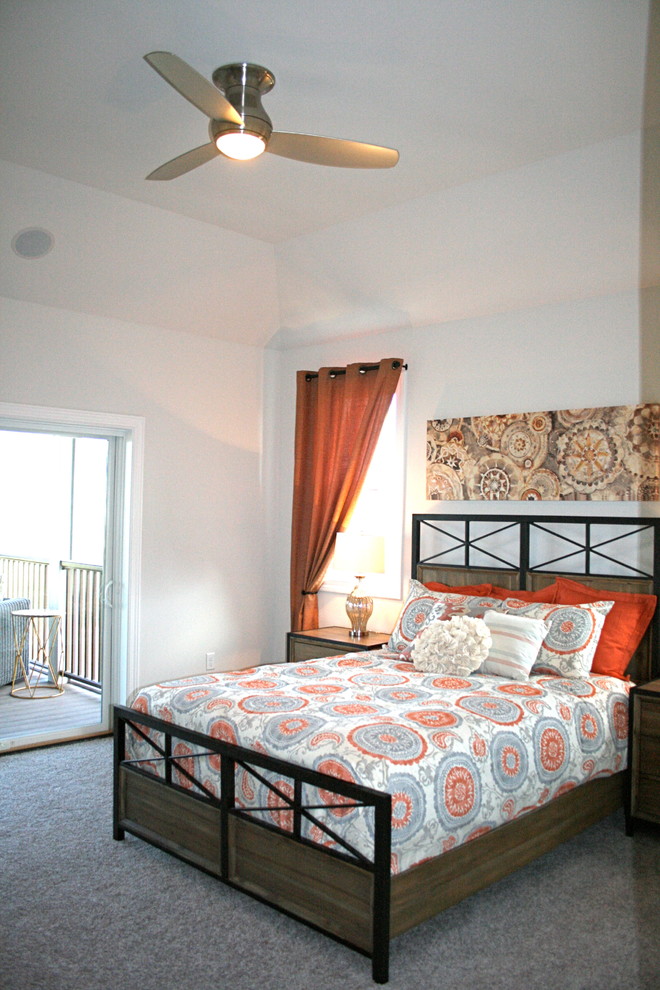 Photo of a mid-sized transitional master bedroom in Milwaukee with grey walls and carpet.