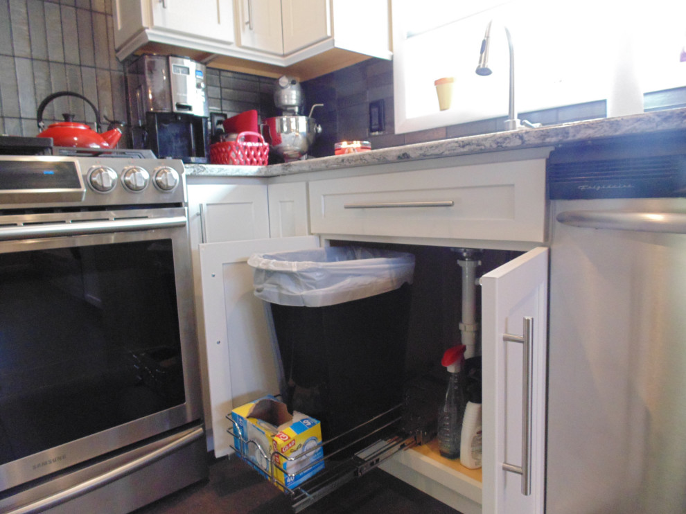 Inspiration for a small transitional l-shaped ceramic tile and brown floor eat-in kitchen remodel with an undermount sink, recessed-panel cabinets, white cabinets, quartz countertops, gray backsplash, subway tile backsplash, stainless steel appliances, an island and gray countertops