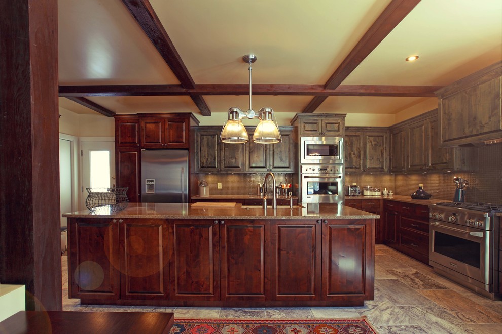 Large l-shaped ceramic tile eat-in kitchen photo with a drop-in sink, medium tone wood cabinets, granite countertops, stainless steel appliances and an island