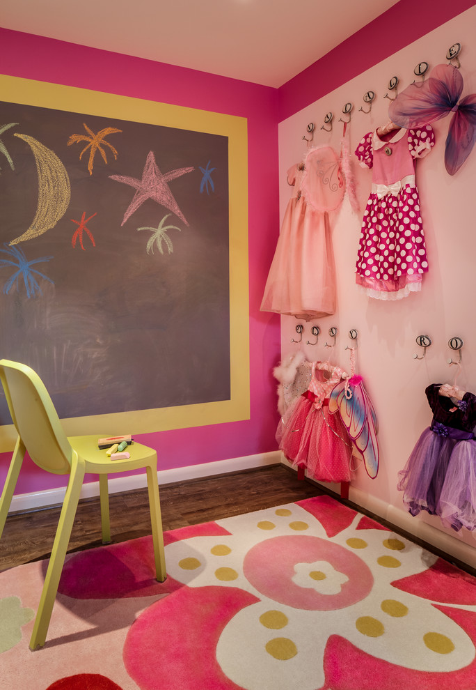 Design ideas for a mid-sized contemporary kids' playroom for kids 4-10 years old and girls in DC Metro with dark hardwood floors, multi-coloured walls and pink floor.