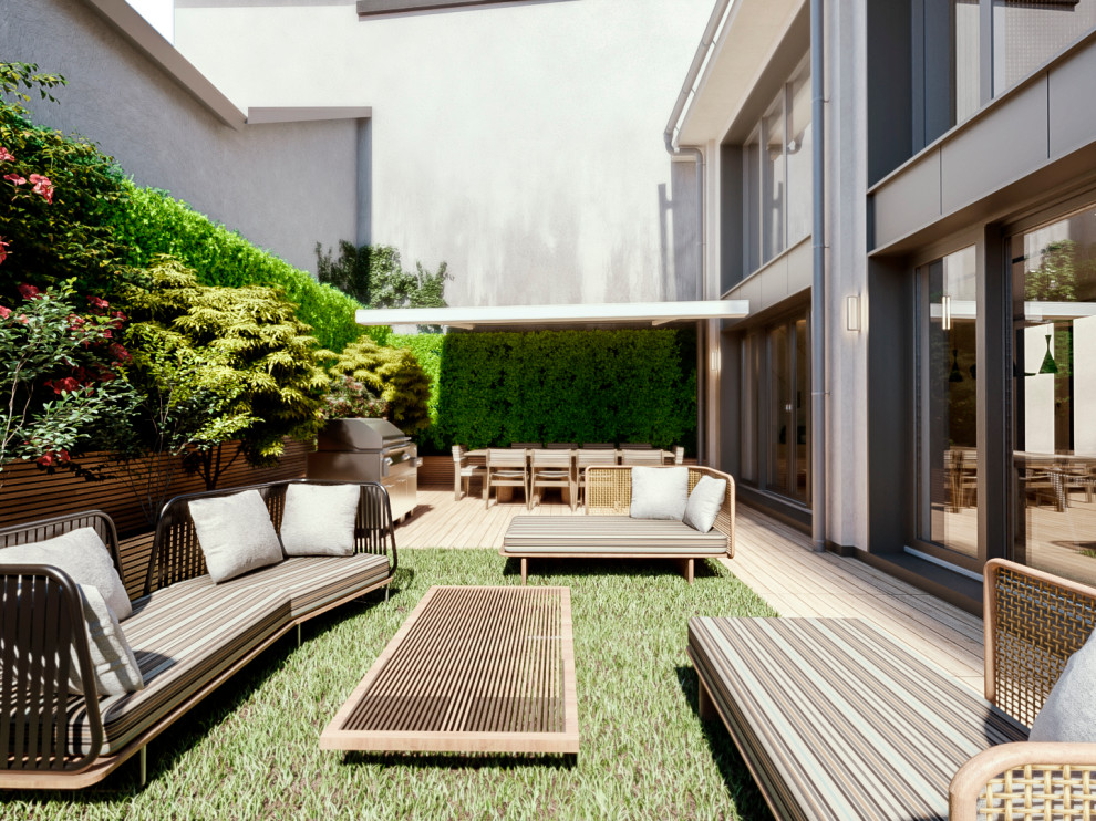 Photo of a mid-sized contemporary partial sun wood fence landscaping in Milan for summer.