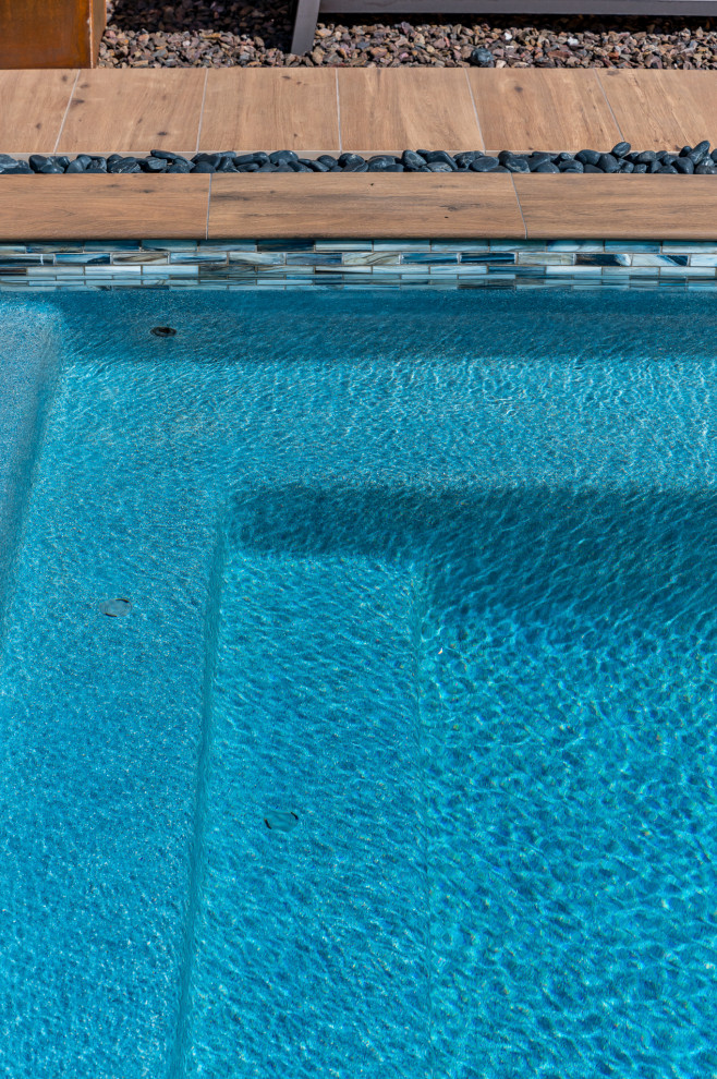 Small backyard tile and rectangular pool photo in Phoenix