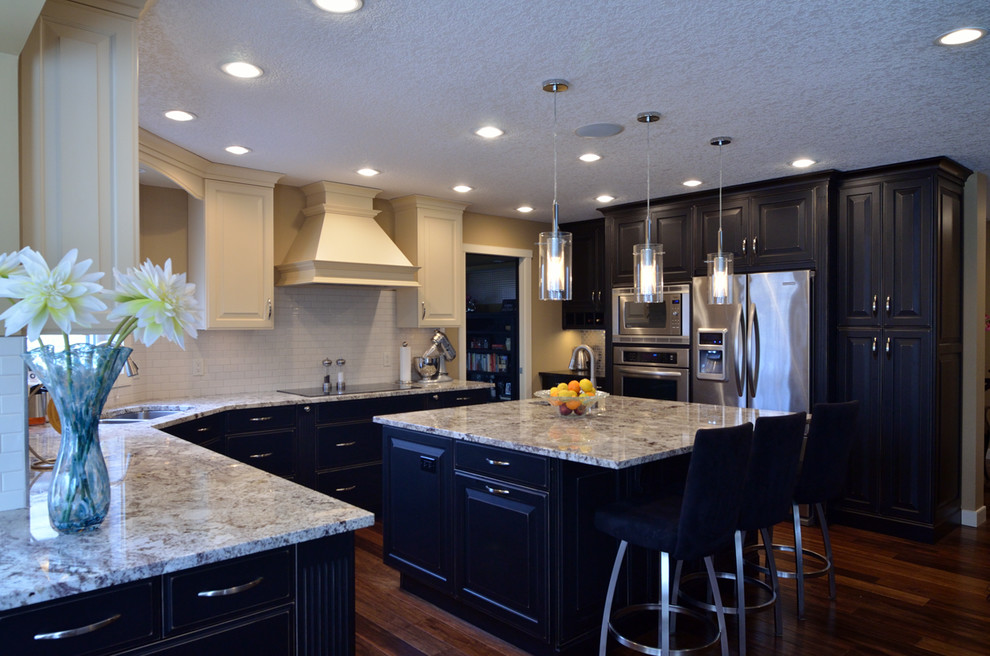 Example of a transitional kitchen design in Calgary