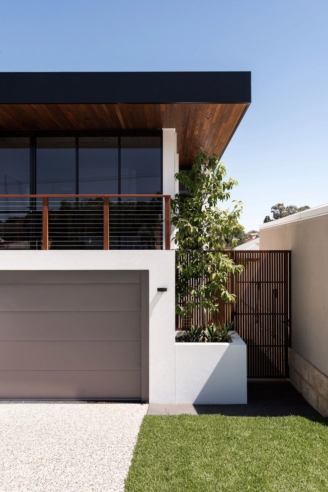Large contemporary two-storey white house exterior in Perth with wood siding, a flat roof and a metal roof.