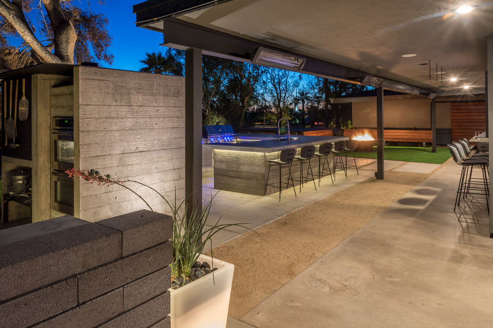 Inspiration for a huge transitional backyard concrete patio kitchen remodel in Phoenix with no cover