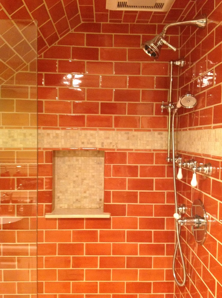 Design ideas for a mid-sized traditional bathroom in New York with orange tile and subway tile.