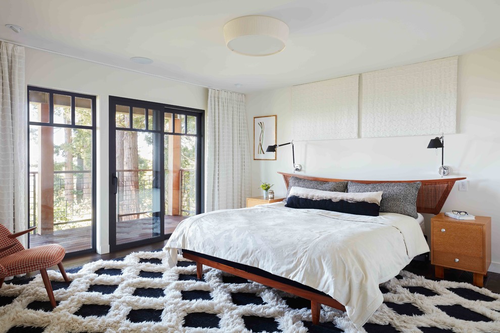 Design ideas for a transitional bedroom in San Francisco with dark hardwood floors, brown floor and white walls.