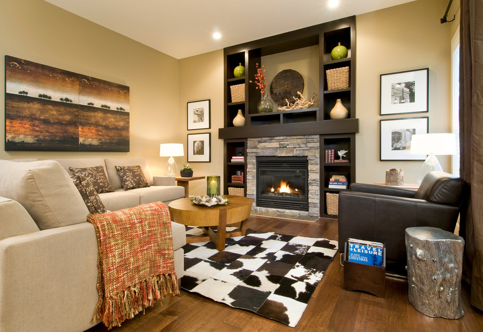 Photo of an eclectic living room in Calgary with a stone fireplace surround.