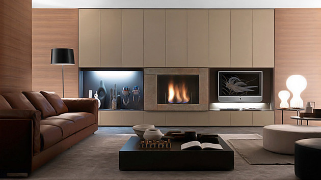 This is an example of a mid-sized contemporary formal open concept living room in Miami with brown walls, medium hardwood floors, a standard fireplace, a stone fireplace surround and a wall-mounted tv.