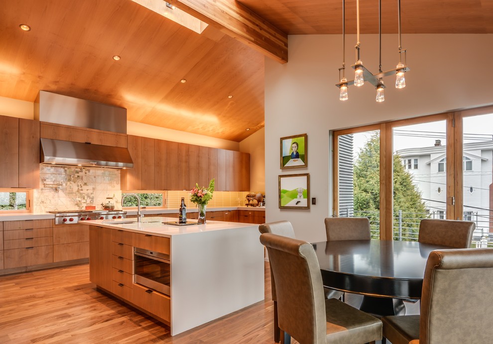 Eat-in kitchen - mid-sized modern l-shaped medium tone wood floor eat-in kitchen idea in Seattle with a double-bowl sink, flat-panel cabinets, medium tone wood cabinets, beige backsplash, ceramic backsplash, stainless steel appliances, an island and quartzite countertops