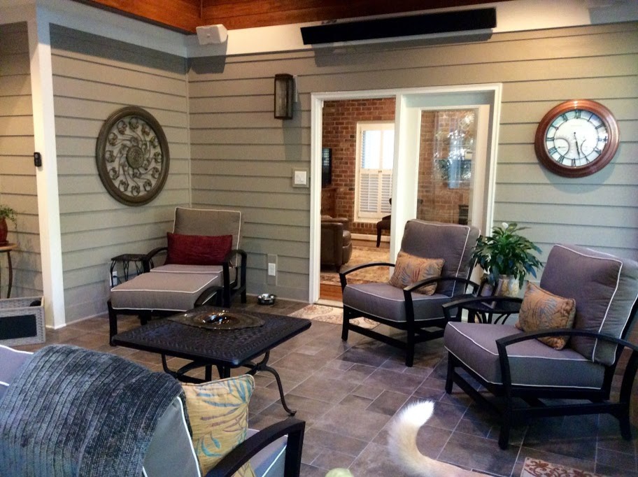Mid-sized transitional backyard screened-in verandah in Raleigh with tile and a roof extension.