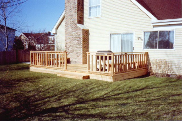 Inspiration for a small rustic backyard deck remodel in Chicago