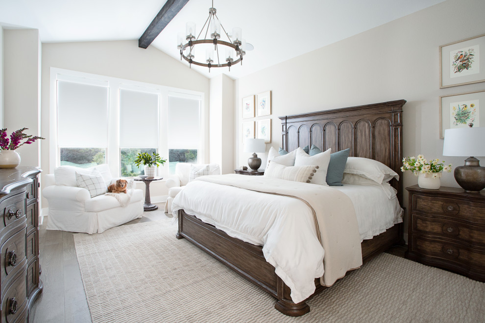 Inspiration for a transitional master exposed beam bedroom remodel in Austin