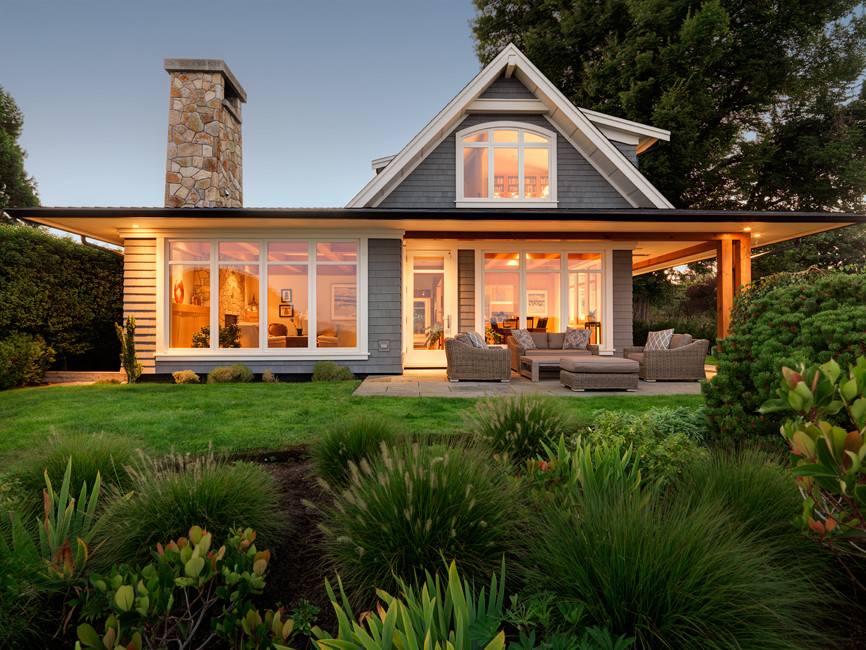 Transitional beige two-story wood gable roof photo with a shingle roof