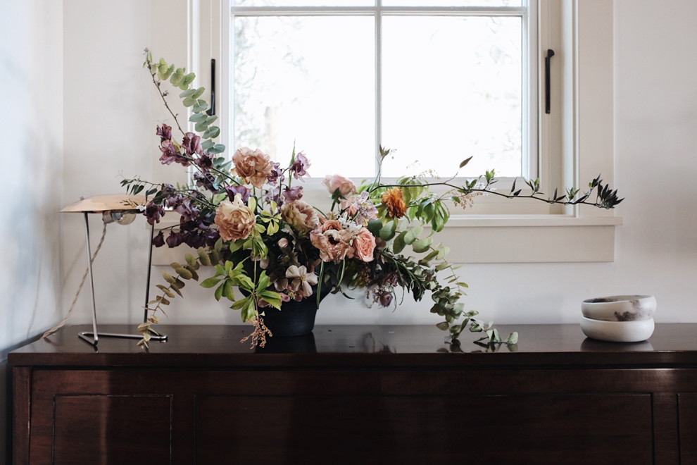 Living room - mid-sized country medium tone wood floor living room idea in San Francisco with a standard fireplace and a stone fireplace