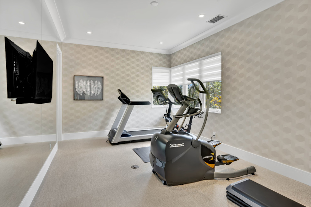 Design ideas for a mid-sized contemporary home gym in Miami with beige walls, laminate floors and beige floor.
