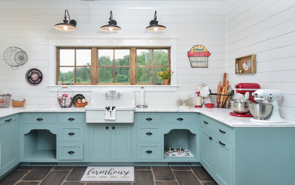 Design ideas for a country u-shaped utility room in Other with a farmhouse sink, shaker cabinets, blue cabinets, marble benchtops, white walls, porcelain floors, black floor and white benchtop.