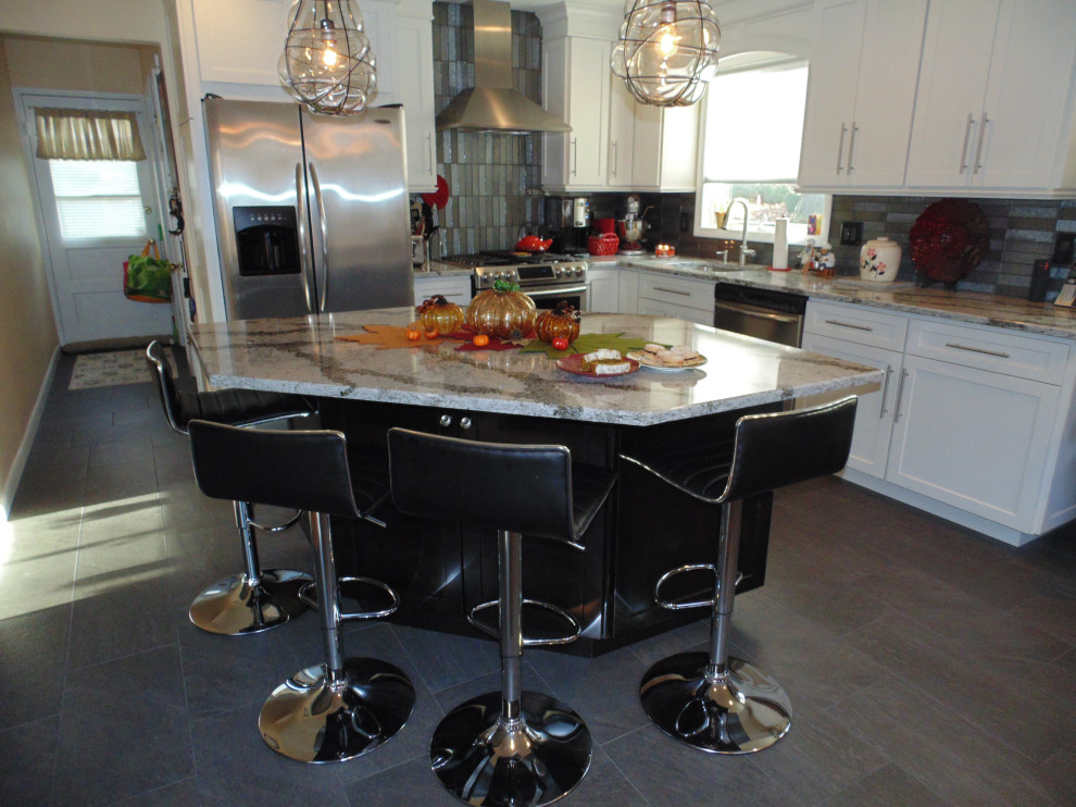 Inspiration for a small transitional l-shaped ceramic tile and brown floor eat-in kitchen remodel with an undermount sink, recessed-panel cabinets, white cabinets, quartz countertops, gray backsplash, subway tile backsplash, stainless steel appliances, an island and gray countertops