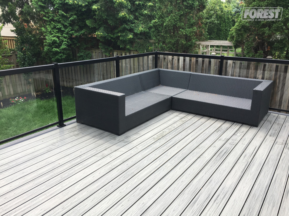 Inspiration for a mid-sized backyard deck remodel in Toronto