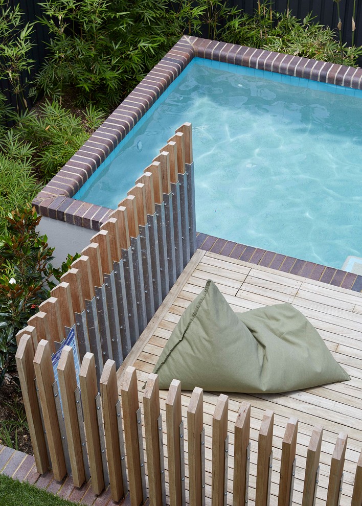 Photo of a small contemporary aboveground pool in Brisbane.