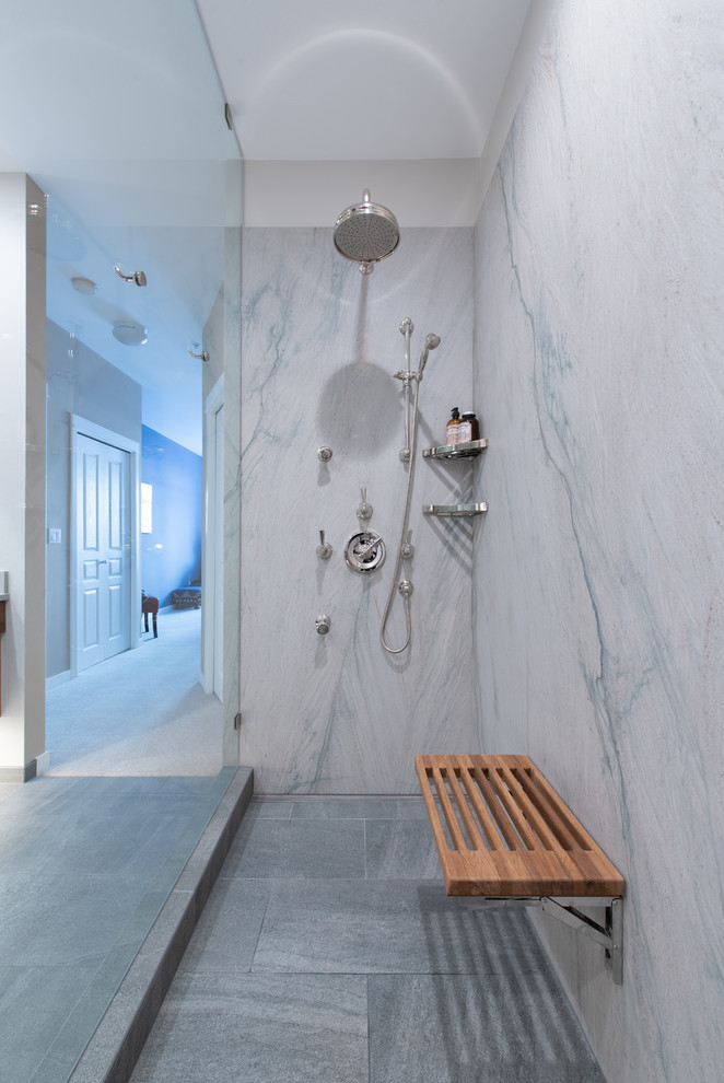 Design ideas for a mid-sized contemporary master bathroom in Seattle with medium wood cabinets, a curbless shower, a two-piece toilet, white tile, marble, white walls, porcelain floors, quartzite benchtops, grey floor, an open shower and white benchtops.