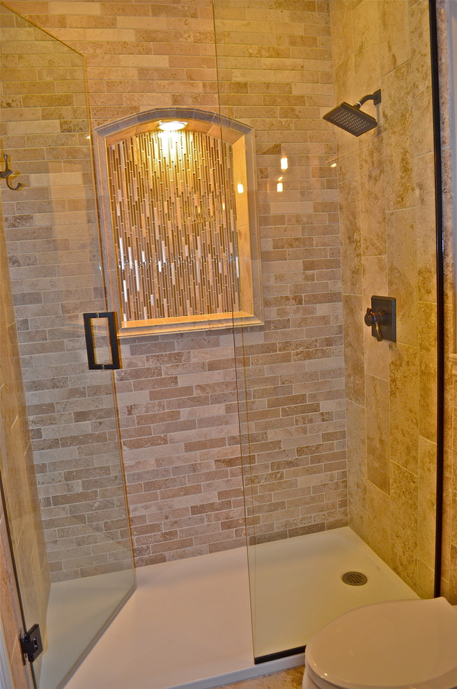 Example of a mountain style travertine floor home design design in Omaha with an undermount sink and solid surface countertops
