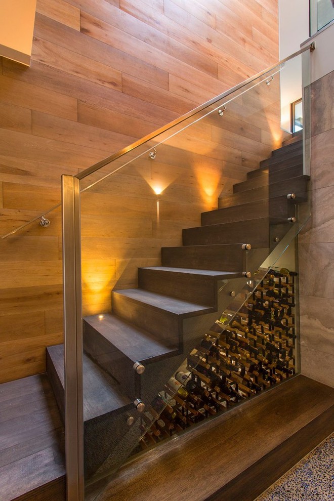 This is an example of a mid-sized contemporary wood straight staircase in Melbourne with wood risers.