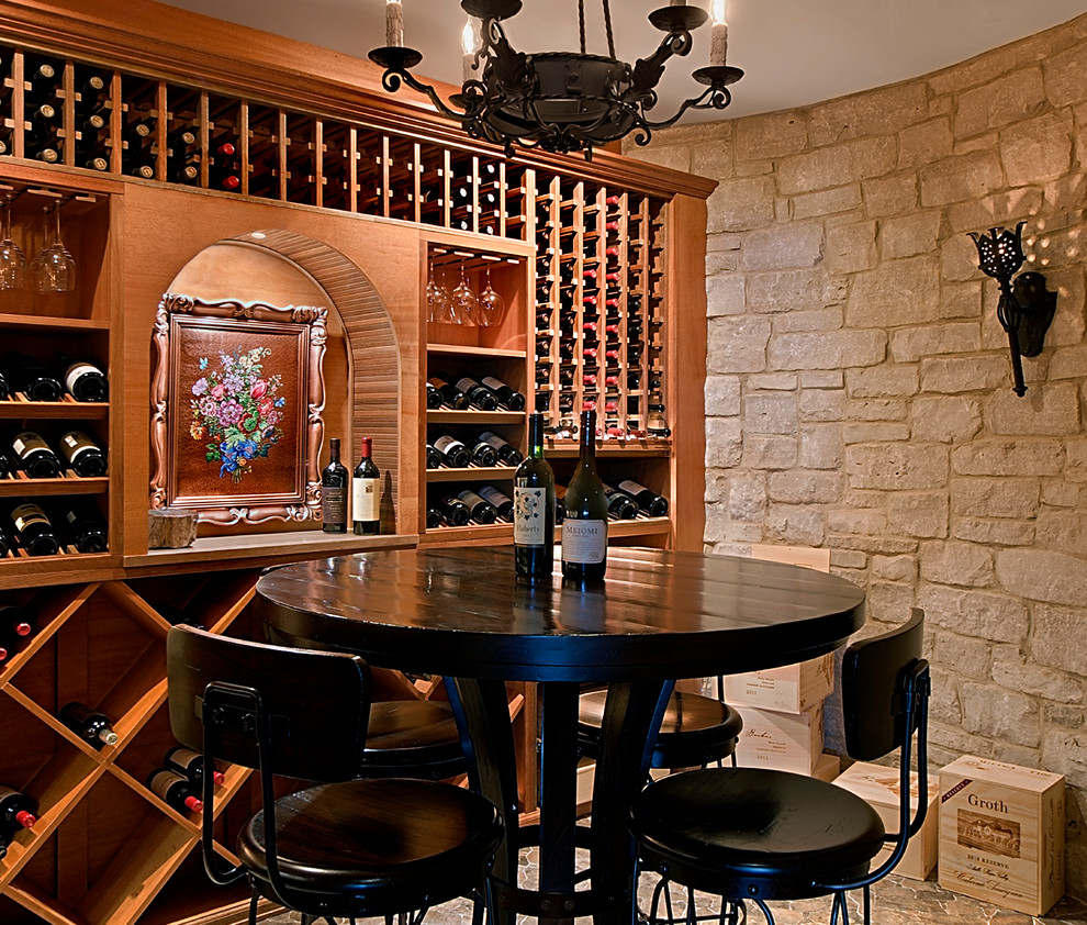 Photo of a mid-sized mediterranean wine cellar in Chicago with storage racks, brown floor and ceramic floors.