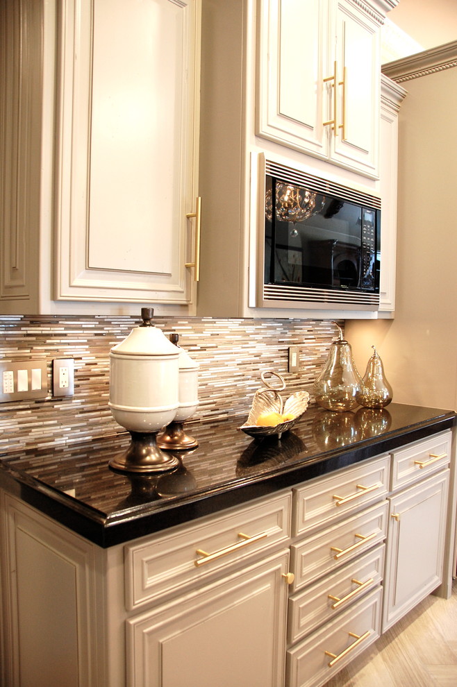 Example of a mid-sized transitional single-wall porcelain tile and beige floor eat-in kitchen design with raised-panel cabinets, gray cabinets, granite countertops, metallic backsplash, metal backsplash, stainless steel appliances and two islands