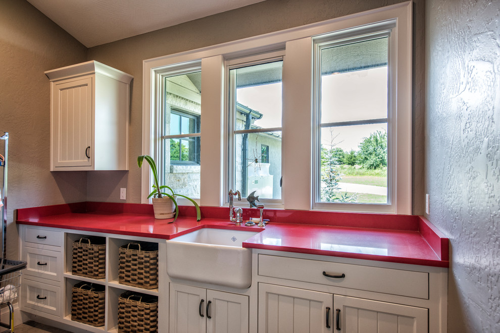 Inspiration for a rustic galley utility room remodel with a farmhouse sink