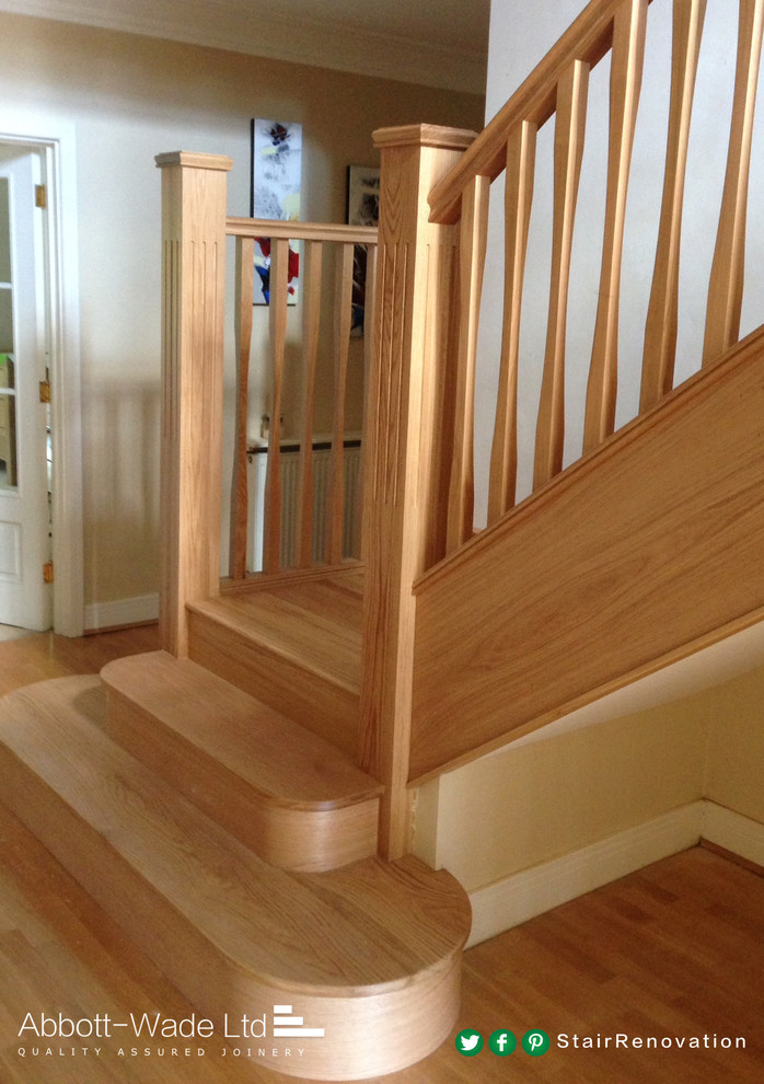 Photo of a contemporary wood l-shaped staircase in Cheshire with wood risers.