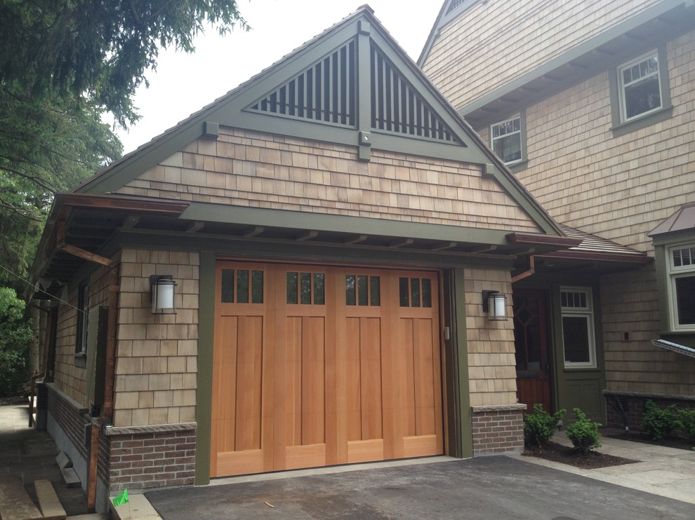 Design ideas for a mid-sized arts and crafts attached one-car garage in Toronto.